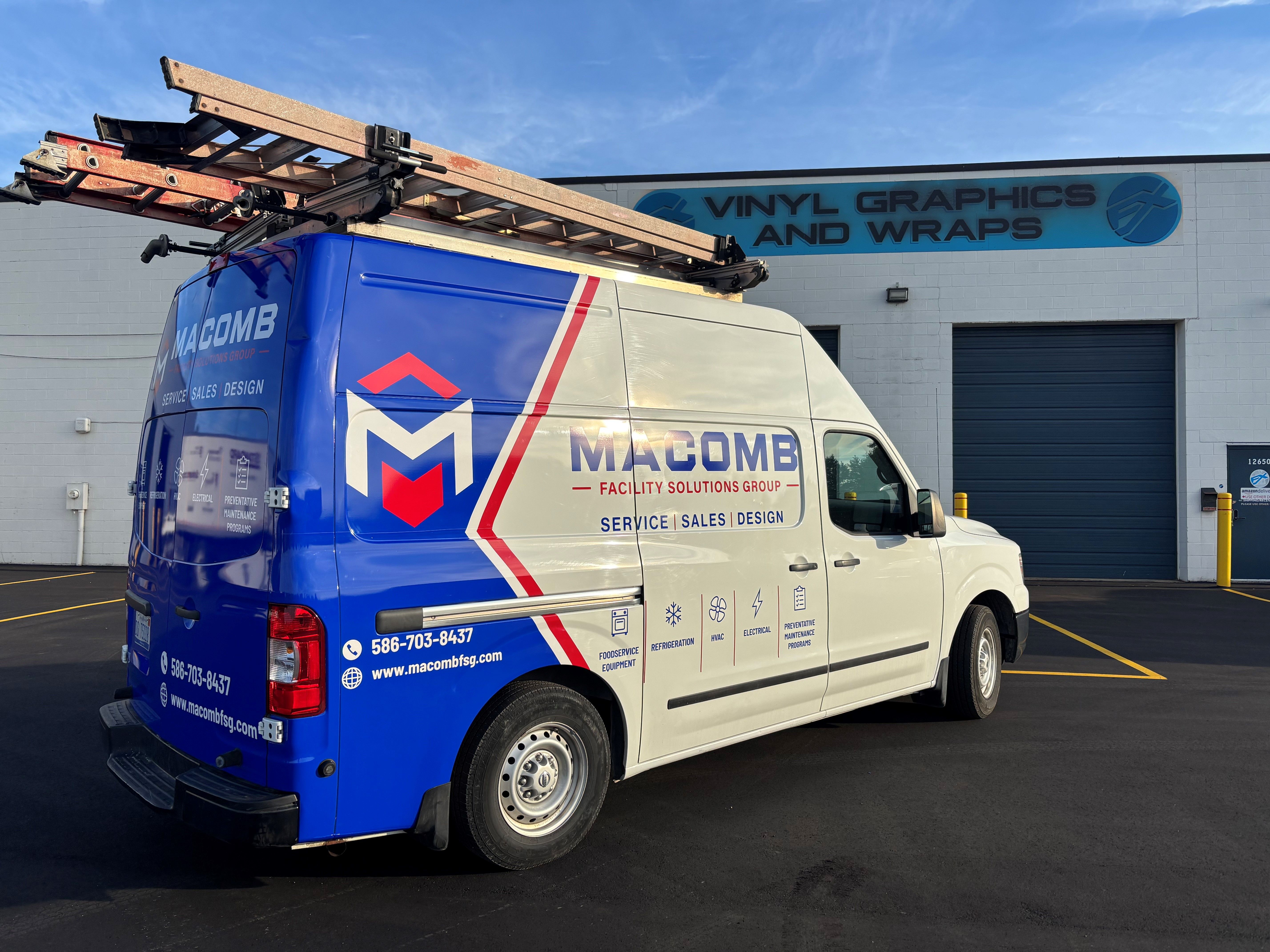 A commercial work van with a custom vinyl wrap with blue, white, and red text and logos