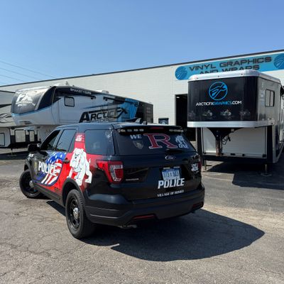 A police vehicle with an American Flag design  vinyl wrap