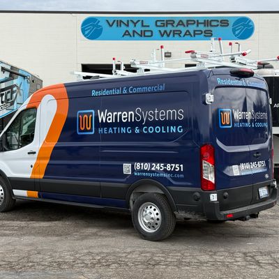 A commercial work van with a custom vinyl wrap with white, blue, and orange logos and design