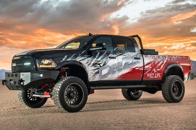 A commercial work truck with a custom vinyl wrap with red, white, and black logos and text with a grunge design