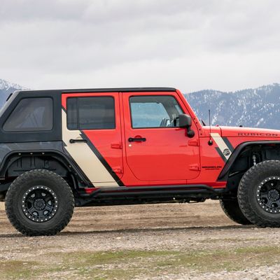 A personal jeep car with a custom vinyl wrap with tan and black stripes