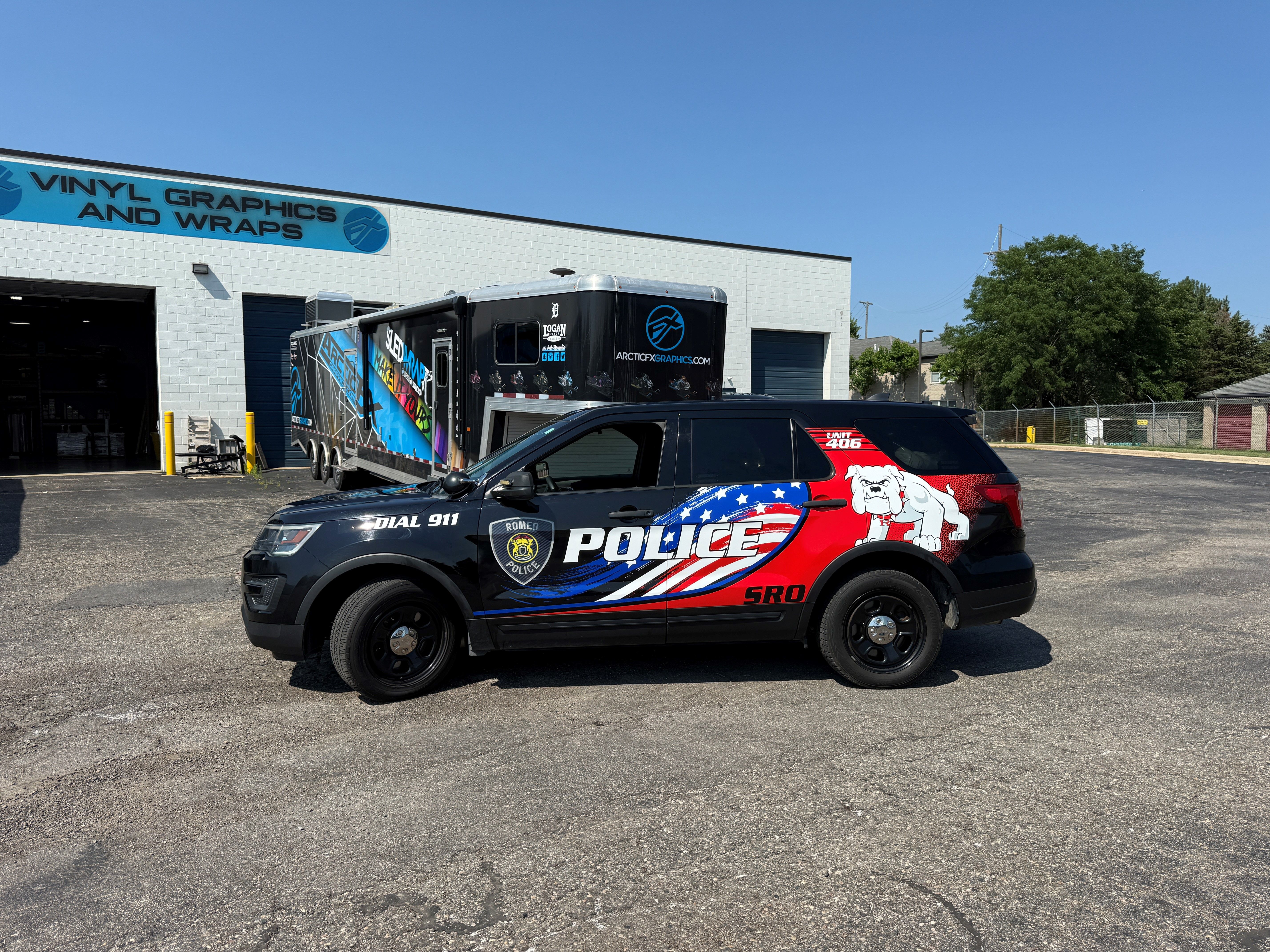 A police vehicle with an American Flag design vinyl wrap